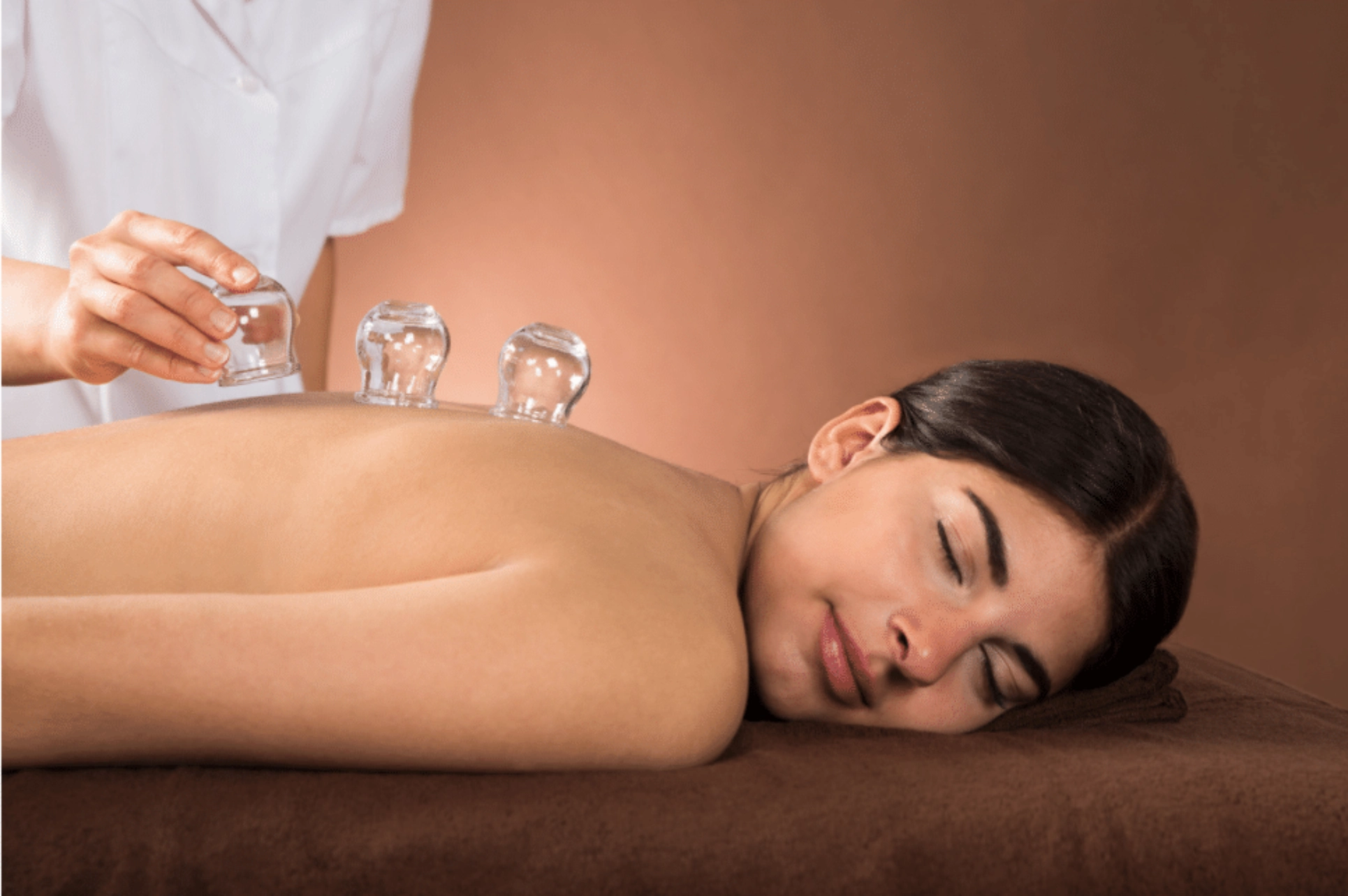 Woman enjoying calming full-body massage.